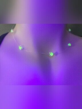 Handmade floating-style choker featuring glowing uranium glass beads